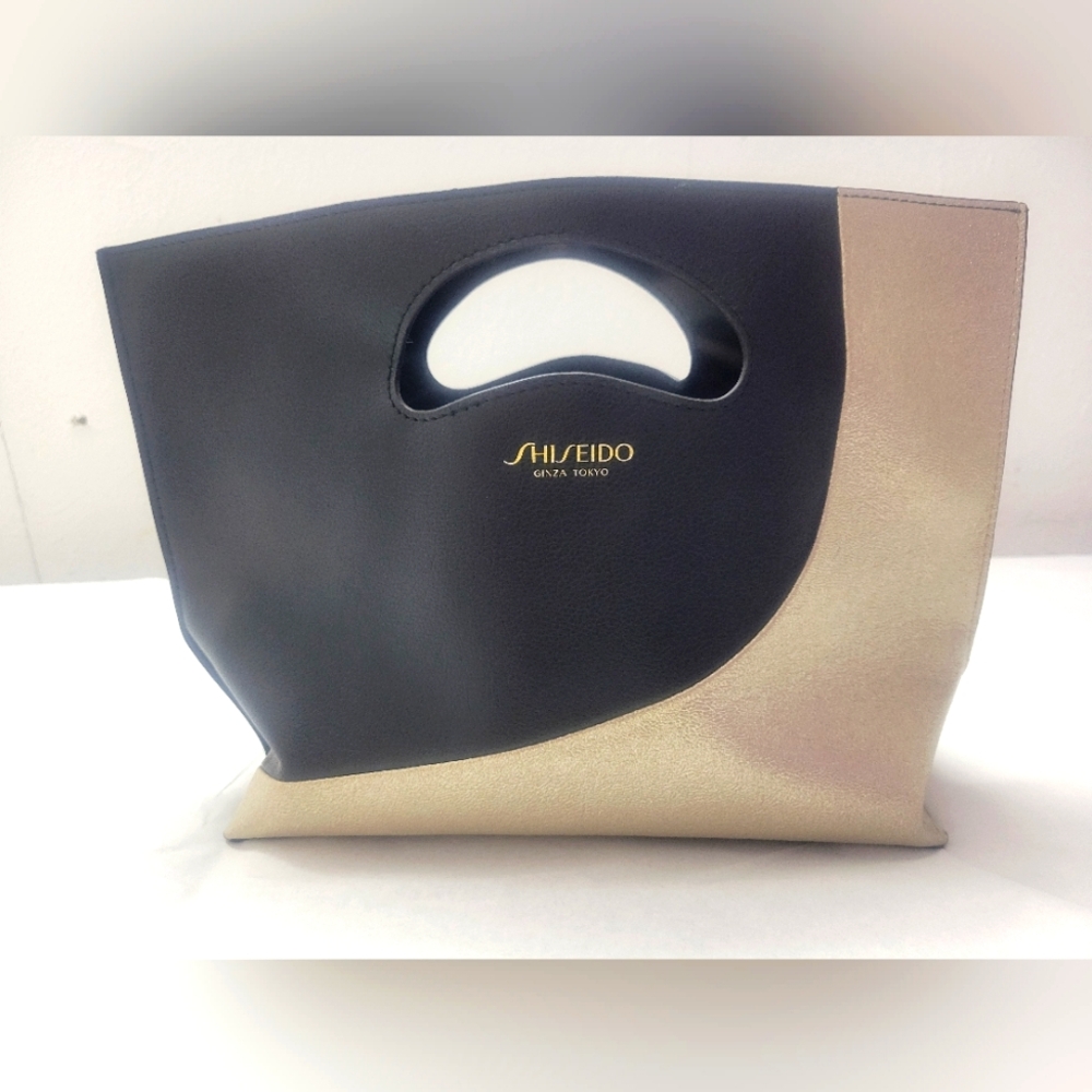Shiseido black and gold clutch